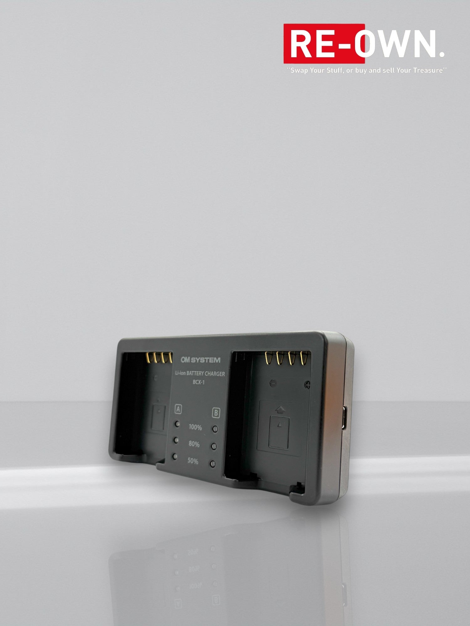 Om system SBCX- 1 batterij BLX1 + lader set